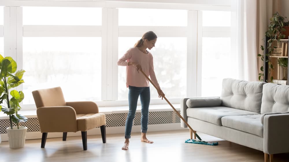 Wood Floor Maintenance | Women cleaning wood floor