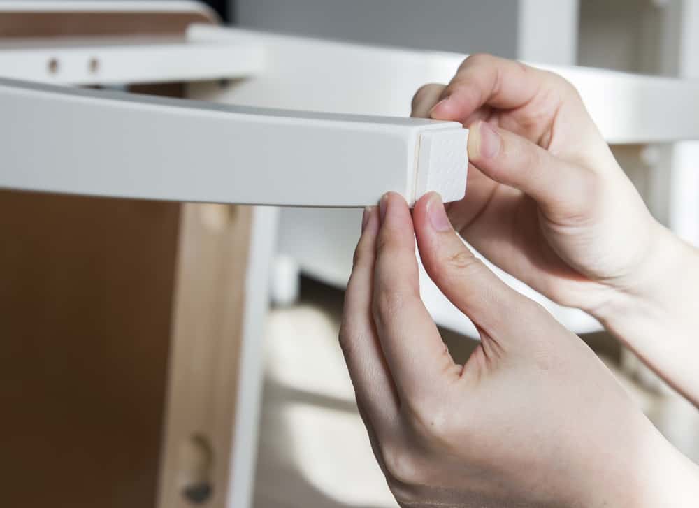 Will Heavy Furniture Damage Wood Floors? | putting padding on a chair leg