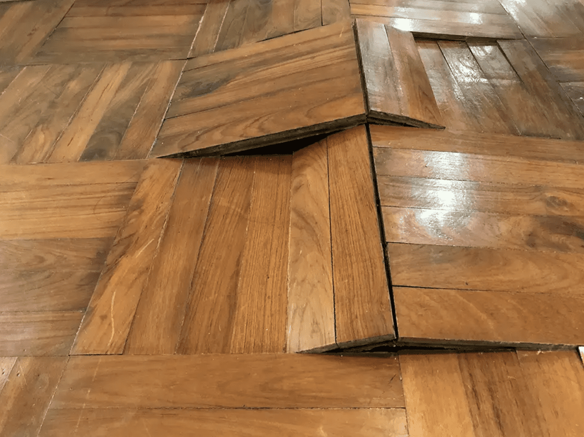Wood Floor Water Damage | Floor boards raising