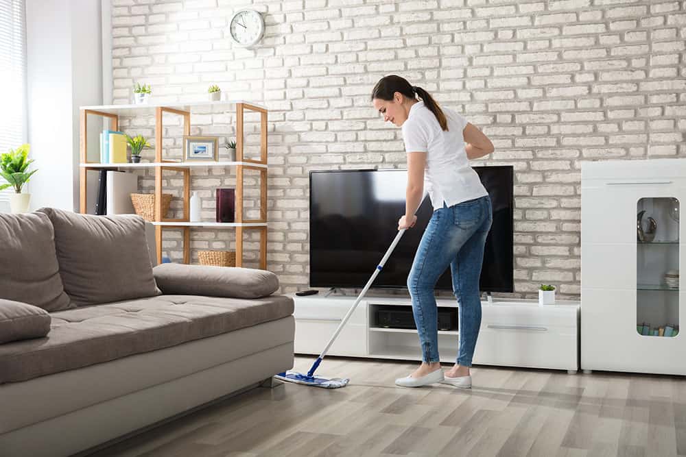 Woman Cleaning A Floor With Mop