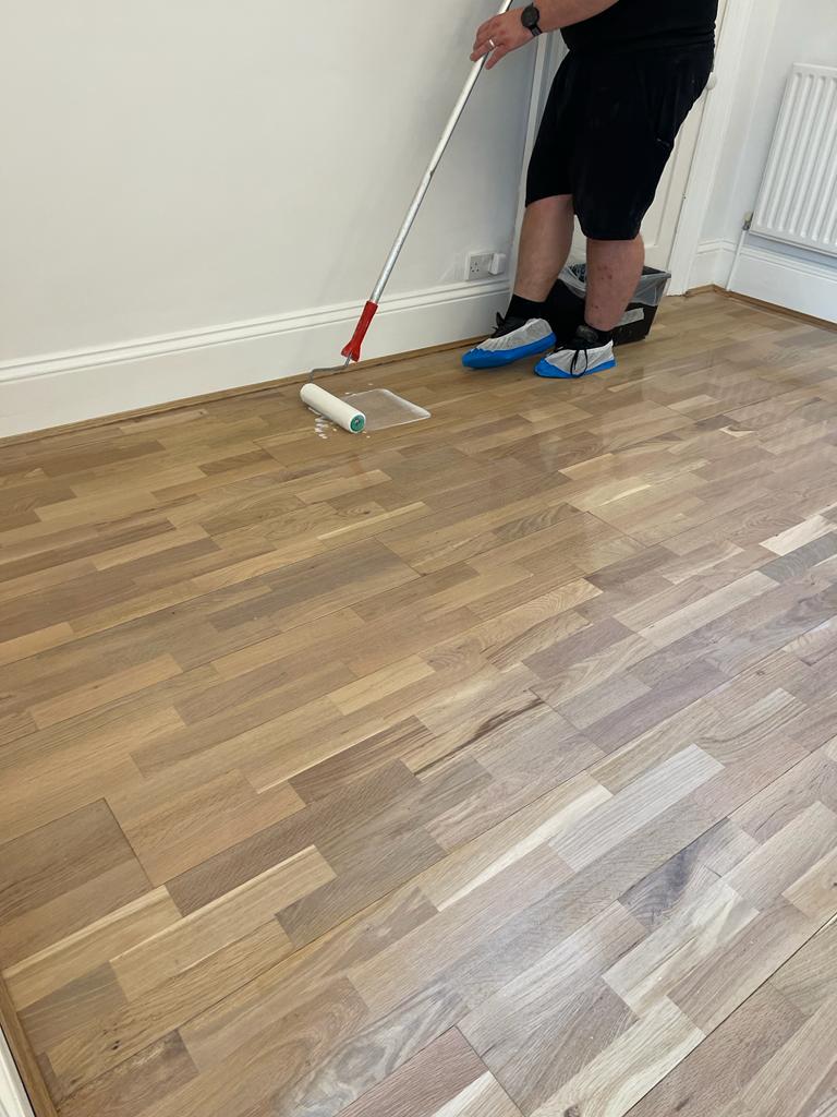 Home Floor Sanding | putting lacquer on wooden floor