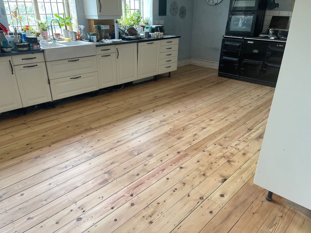 Hard Floor Restoration | refinished wood floor in kitchen
