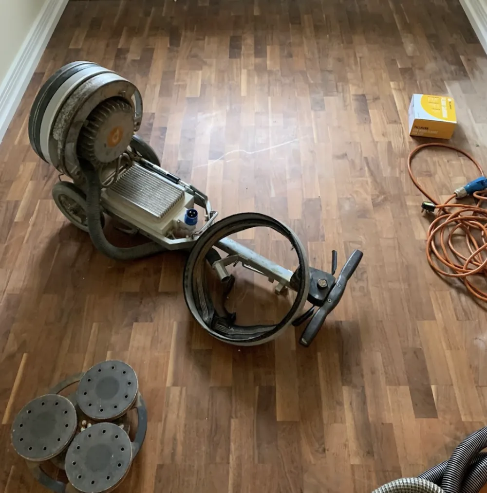 How We Restore Solid Wood Floors | Sanding machine on wooden floor.