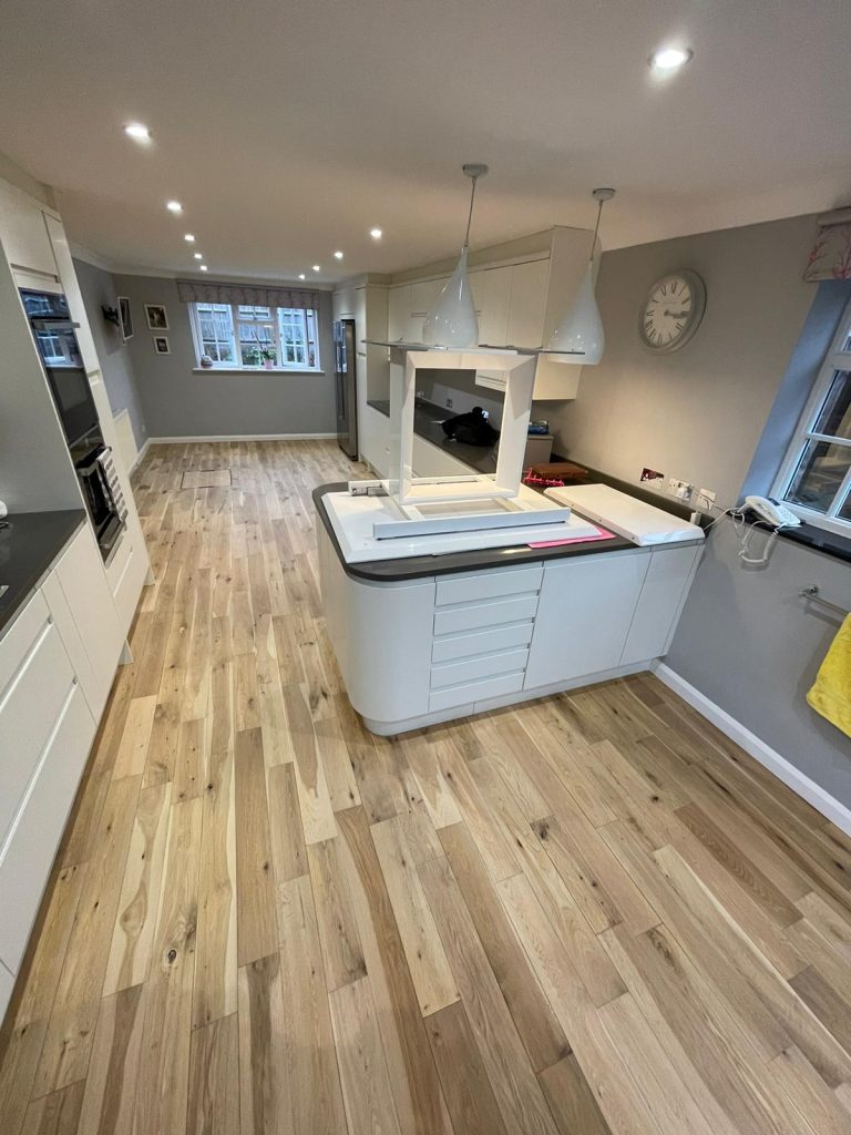 Restored floorboards in a kitchen space